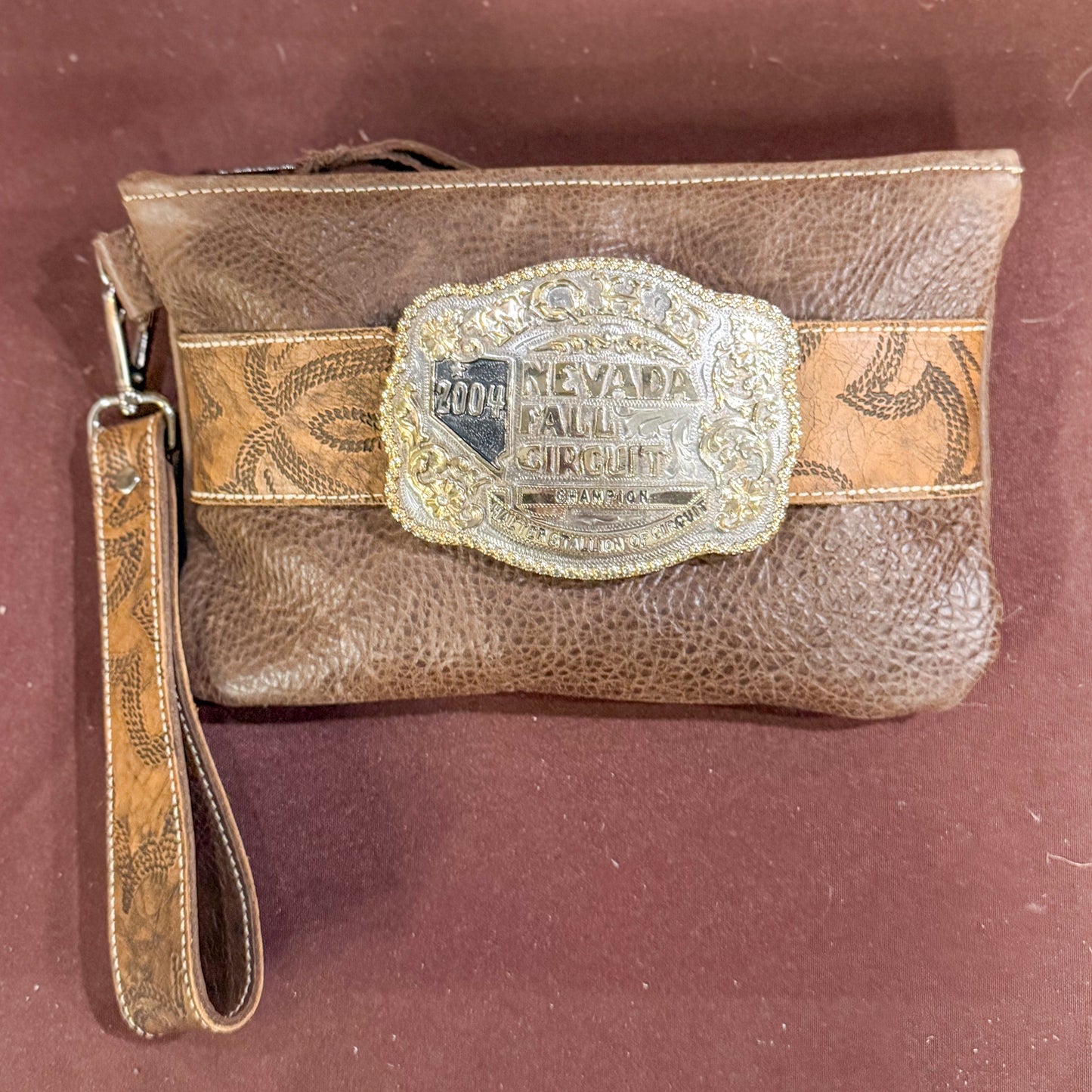 Trophy Buckle Leather Wristlet Bag In Rustic Cocoa